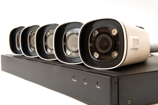 Digital Video Recorder and video surveillance cameras on white background.